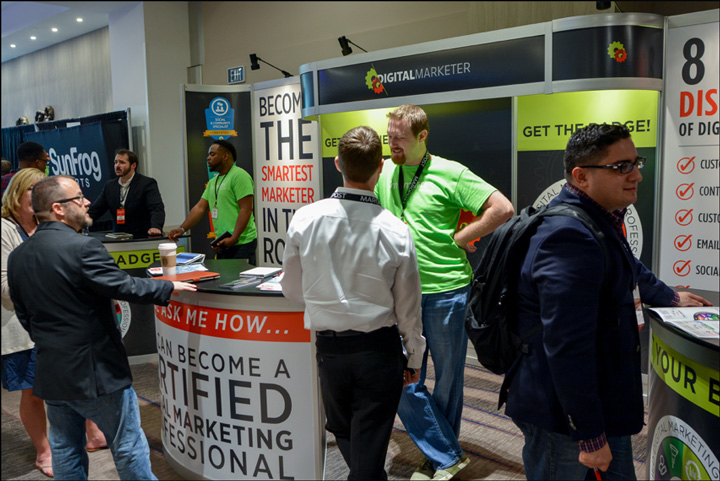 The DigitalMarketer Booth manned by DM employees from a previous Traffic & Conversion Summit