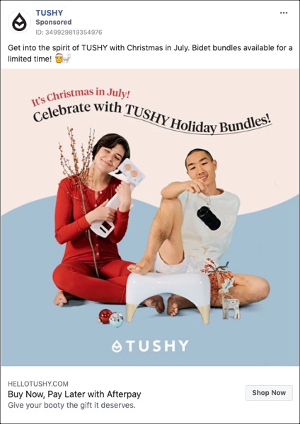 A colorful Tushy Facebook ad with a Christmas in July theme, two people holding items from the company, advertising Tushy Holiday Bundles.