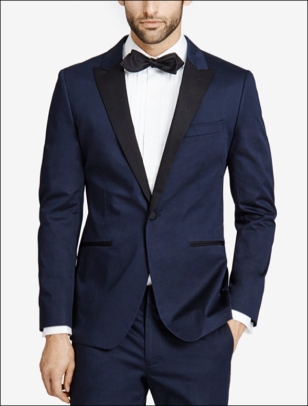 A man modeling a navy blue suit